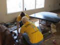 Volunteer-ministers-cleaning-up-after-flood it.jpg
